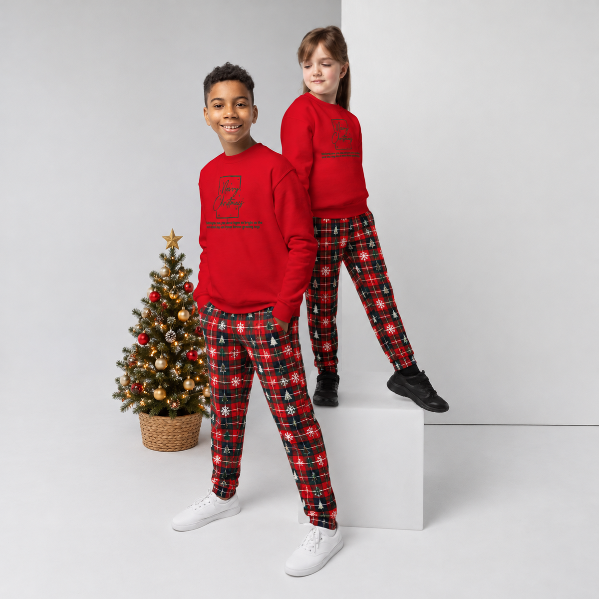 Kid wearing matching family Merry Christmas sweatshirt – joy of family guiding star