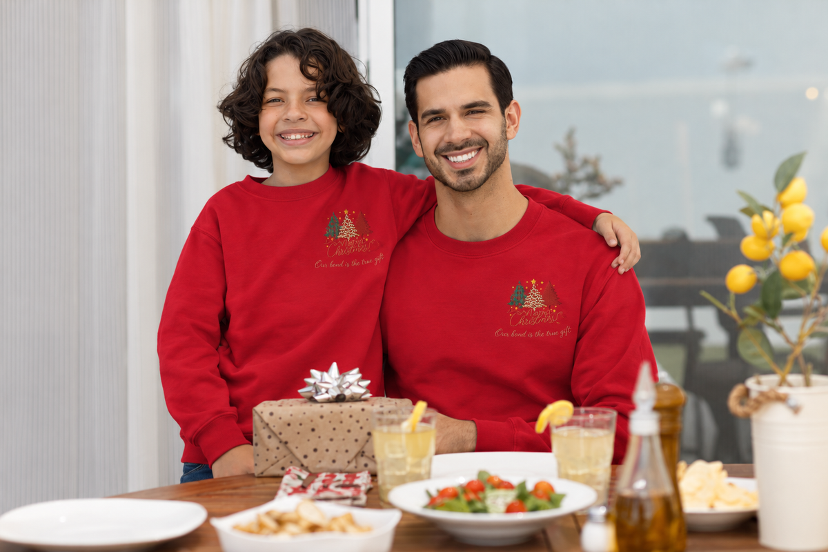 Parents and kids in matching embroidered Christmas tree sweatshirts
