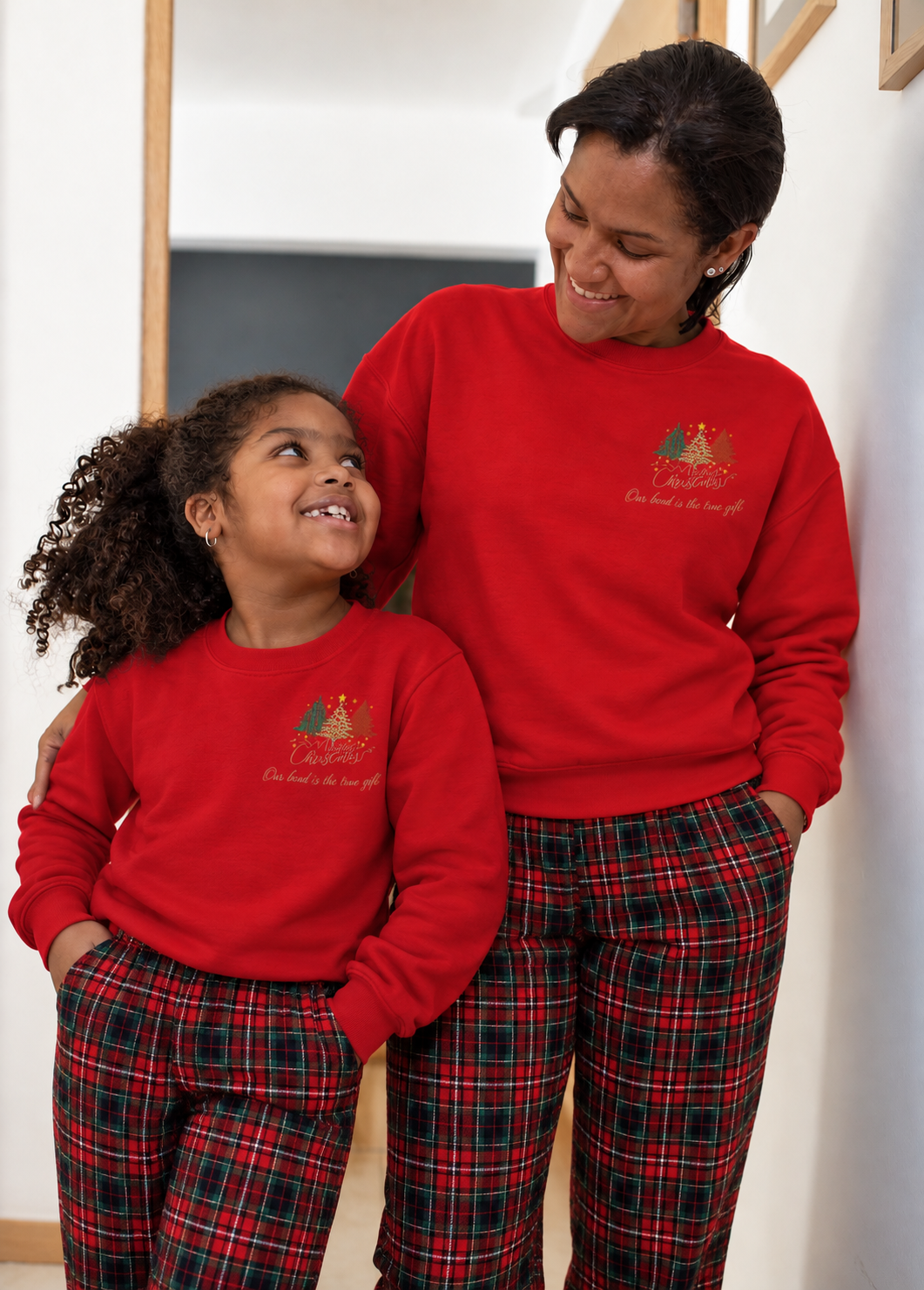 Matching family Christmas sweatshirts with embroidered Merry Christmas trees